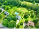 Aerial view of house with pool on large lot with some trees at 125 Drennan Dr, Fayetteville, GA 30215