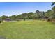 Large backyard featuring in-ground pool and trees for privacy at 125 Drennan Dr, Fayetteville, GA 30215