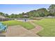 Well-manicured backyard featuring an in-ground pool, seating area, and privacy fence at 125 Drennan Dr, Fayetteville, GA 30215
