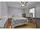 Bedroom with hardwood floors, natural light, and neutral paint at 125 Drennan Dr, Fayetteville, GA 30215