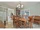 Open dining room with wood table and chairs next to a vintage piano at 125 Drennan Dr, Fayetteville, GA 30215
