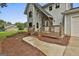 Charming front porch with a wooden deck, stone accents, and a landscaped walkway at 125 Drennan Dr, Fayetteville, GA 30215