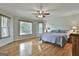 Spacious main bedroom with hardwood floors and natural light from large windows at 125 Drennan Dr, Fayetteville, GA 30215