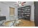 Bright office featuring wood floors, built-in shelving and desk area at 125 Drennan Dr, Fayetteville, GA 30215