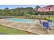 Backyard pool with a diving board, a table, and some chairs at 125 Drennan Dr, Fayetteville, GA 30215