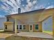 The backyard has a covered porch and yard at 473 Cherry Creek Dr, Loganville, GA 30052