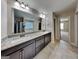 Bathroom has double vanities and a long mirror at 473 Cherry Creek Dr, Loganville, GA 30052