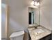 Bathroom featuring granite countertop, undermount sink, and modern fixtures at 473 Cherry Creek Dr, Loganville, GA 30052