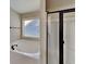Bathroom with a bathtub and enclosed shower at 473 Cherry Creek Dr, Loganville, GA 30052