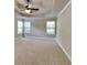 Bright bedroom with three windows and neutral carpet at 473 Cherry Creek Dr, Loganville, GA 30052