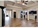 Open-concept living room seamlessly connects to the kitchen with sleek hardwood flooring and modern finishes at 473 Cherry Creek Dr, Loganville, GA 30052
