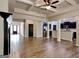 Open-concept living room showcasing vinyl flooring, a modern kitchen, and ample space for entertaining guests at 473 Cherry Creek Dr, Loganville, GA 30052