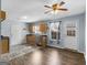 Open kitchen boasts stainless steel appliances, wood cabinets and view to the backyard at 255 Brandon Ridge Cir, Stockbridge, GA 30281