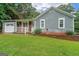 This charming home has a well-kept yard, inviting front porch, and attached one car garage at 295 Pinehurst Dr, Stockbridge, GA 30281
