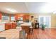 Bright kitchen with breakfast bar, wood cabinets, tile floors, and stainless steel appliances at 295 Pinehurst Dr, Stockbridge, GA 30281