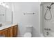 Clean bathroom featuring a shower and vanity sink with wooden cabinets at 655 Sunset Dr, Locust Grove, GA 30248