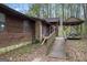 Charming home exterior with a wooden ramp leading to the front entrance and a gazebo at 655 Sunset Dr, Locust Grove, GA 30248
