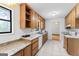 Kitchen with laminate countertops and wooden cabinets at 655 Sunset Dr, Locust Grove, GA 30248