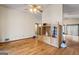 Open-concept living room with hardwood floors, built-in shelving, and access to a patio at 655 Sunset Dr, Locust Grove, GA 30248