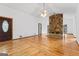 Bright living room featuring hardwood floors, a fireplace, and a stained glass door at 655 Sunset Dr, Locust Grove, GA 30248