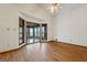 Bright living room featuring hardwood floors, and large windows providing abundant natural light at 655 Sunset Dr, Locust Grove, GA 30248