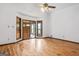 Well-lit living room with hardwood floors and large windows at 655 Sunset Dr, Locust Grove, GA 30248