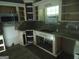 Kitchen featuring granite counters and open cabinets, ready for customization at 390 Burg Rd, Locust Grove, GA 30248