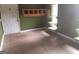 Functional mud room with tiled flooring, built-in storage, and convenient exterior door access at 390 Burg Rd, Locust Grove, GA 30248
