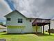 View of the home's backyard with a deck at 426 Summer Hill Cir, Stockbridge, GA 30281