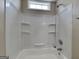 Bathroom featuring a bathtub, shower head, and small window at 426 Summer Hill Cir, Stockbridge, GA 30281