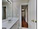 Bathroom featuring a single sink vanity and a view into the hall at 426 Summer Hill Cir, Stockbridge, GA 30281