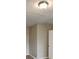 A carpeted bedroom with neutral colored walls and light fixture at 426 Summer Hill Cir, Stockbridge, GA 30281