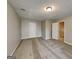 Bedroom with carpeted flooring, neutral walls, and two entry doors at 426 Summer Hill Cir, Stockbridge, GA 30281