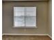 This carpeted bedroom has a window with blinds and neutral colored walls at 426 Summer Hill Cir, Stockbridge, GA 30281