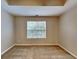 Comfortable bedroom featuring soft carpeting, a large window that allows natural light, and ample space at 426 Summer Hill Cir, Stockbridge, GA 30281