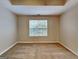 Neutral bedroom featuring carpeted flooring, a window with blinds, and light fixtures at 426 Summer Hill Cir, Stockbridge, GA 30281