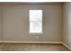 Carpeted bedroom with a window and neutral colored walls at 426 Summer Hill Cir, Stockbridge, GA 30281