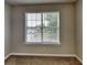 This carpeted bedroom shows a window with blinds at 426 Summer Hill Cir, Stockbridge, GA 30281