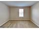 Bedroom has neutral walls and carpet with a window letting in natural light at 426 Summer Hill Cir, Stockbridge, GA 30281