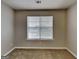Bedroom with neutral walls and carpet and a large window at 426 Summer Hill Cir, Stockbridge, GA 30281