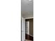 Hallway showing neutral colored walls and dark flooring at 426 Summer Hill Cir, Stockbridge, GA 30281