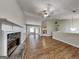 Open living room has wood flooring, a fireplace, and plenty of natural light at 426 Summer Hill Cir, Stockbridge, GA 30281