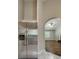Bright, open-concept living space showcasing hardwood floors and an archway leading to the kitchen at 426 Summer Hill Cir, Stockbridge, GA 30281