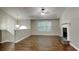 Spacious living room featuring hardwood floors, a fireplace, and abundant natural light from a large window at 426 Summer Hill Cir, Stockbridge, GA 30281