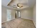 Relaxing main bedroom featuring plush carpet, a ceiling fan, and ensuite bathroom, offering plenty of privacy at 426 Summer Hill Cir, Stockbridge, GA 30281