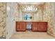 Vintage bathroom with double vanity, floral wallpaper, and ample counter space at 550 Hawthorne Dr, Fayetteville, GA 30214
