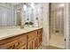 Elegant bathroom with ornate wallpaper, stylish fixtures, and vanity with marble countertop at 550 Hawthorne Dr, Fayetteville, GA 30214