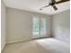 Bright bedroom features a ceiling fan and double doors offering lots of natural light at 550 Hawthorne Dr, Fayetteville, GA 30214