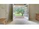 Open French doors lead to a balcony, bright and airy bedroom with neutral carpeting at 550 Hawthorne Dr, Fayetteville, GA 30214