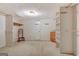 Walk-in closet features built-in shelving, drawers, hanging rods, and carpeted floors at 550 Hawthorne Dr, Fayetteville, GA 30214